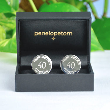 Personalised milestone 40th year birthday cufflinks with name and date engraved around the top and bottom, shown in black Penelopetom cufflinks box.