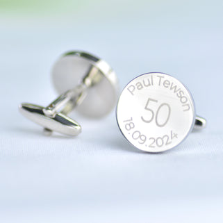 Milestone 50th birthday cufflinks with personalised name and date engraved around the top and bottom, shown in close up shot.