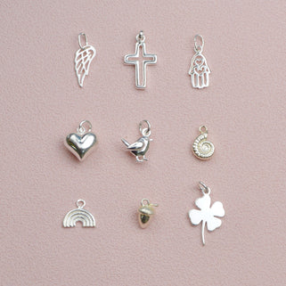 Sterling Silver Hoop Earrings with charm of your choice - showing choice of charms- angel wing, cross, hams hand, heart, robin, ammonite, rainbow, acorn and clover.