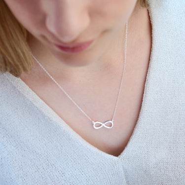 Personalised Sterling Silver Infinity Necklace shown close up on model