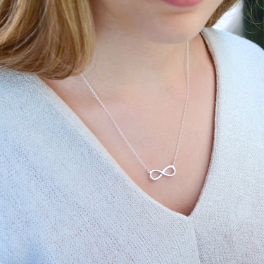 Personalised Sterling Silver Infinity Necklace shown close up on model