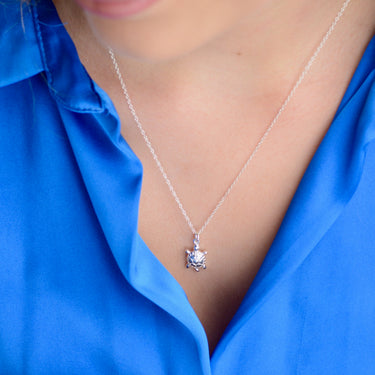 Sterling Silver Turtle Necklace shown in close up on model