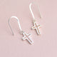 Sterling silver drop earrings with choice of charm shown close up with cross charm