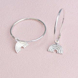 Sterling Silver Hoop Earrings with charm of your choice showing a hoop with rainbow close up .