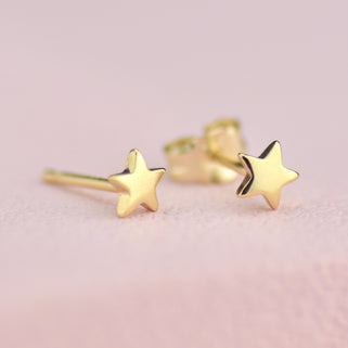 Gold Mini Star Stud Earrings shown close up for detail