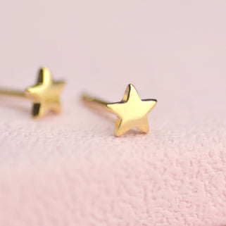 Gold Mini Star Stud Earrings shown close up for detail