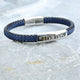 Personalised Men's Leather And Cotton Sliding Bar Bracelet shown close up with engraving