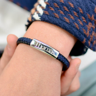 Personalised Men's Leather And Cotton Sliding Bar Bracelet shown close up on model