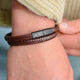 Personalised Men's Recycled Leather Double Wrap Bracelet shown close up on model