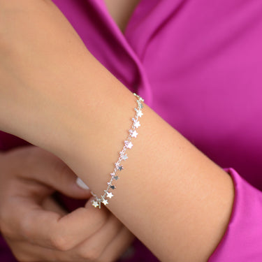 Personalised Mini Silver Star Cluster Bracelet shown close up on model