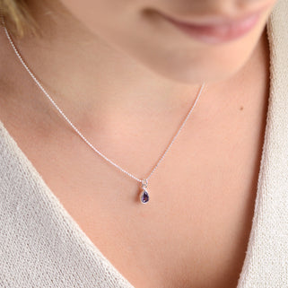 Girl's Sterling Silver Teardrop Birthstone Charm Necklace shown close up with Feb/Amethyst