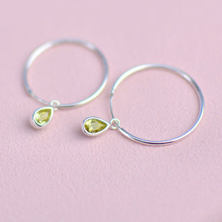 Sterling Silver Teardrop Birthstone Hoop Earrings shown close up with August birthstone