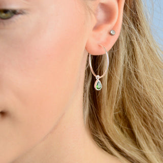 Sterling Silver Teardrop Birthstone Hoop Earrings shown close up with May birthstone