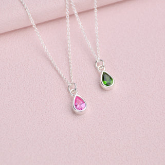 Personalised Silver Teardrop Birthstone Necklace shown close up with October and May birthstones