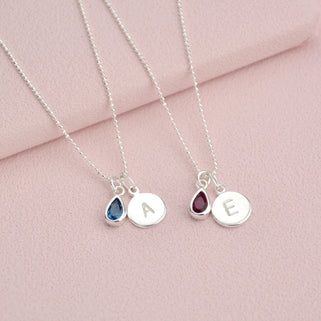 Personalised Silver Girls Initial Teardrop Birthstone Necklace shown close up with December and January Birthstones