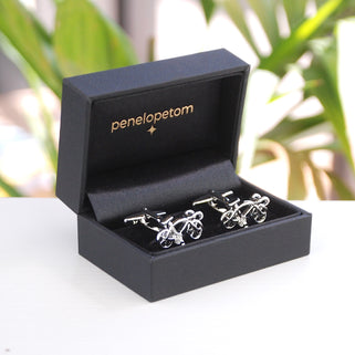 silver racer bike cufflinks shown in black Penelopetom cufflinks box