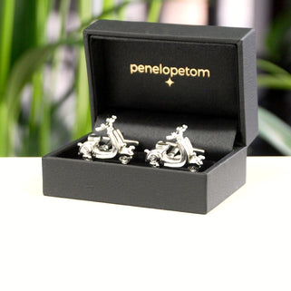 Silver scooter cufflinks shown in black Penelopetom cufflinks box